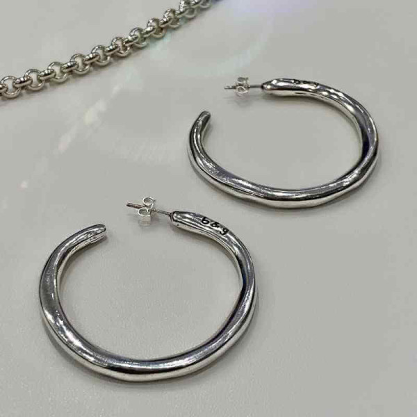 Big, open hoop silver earrings